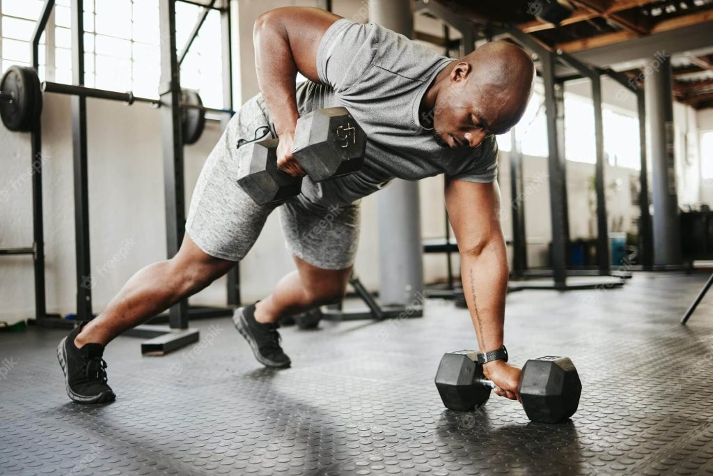 clarence-gym-dumbbell-fitness-bodybuilder-black-man-with-workout-training-gym-garage-studio-wellness-body-goal